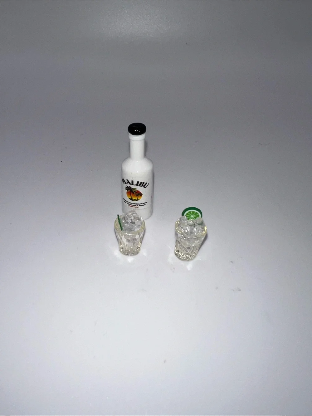 Miniature Malibu and set of drinking glasses